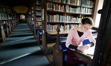 a Student Working in the Library at Corpus Christi College at Oxford University Uk - Good E-reader photo courtesy of guardiancouk